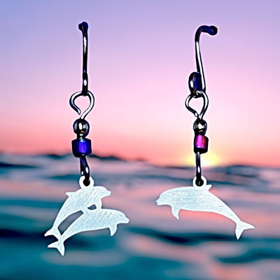 Dolphin Stainless Steel Earrings features one dolphin on one earring and two dolphins on the other. 