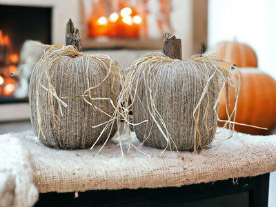 Handmade Twine Pumpkins with Raffia wrapped around the wooden stems. 