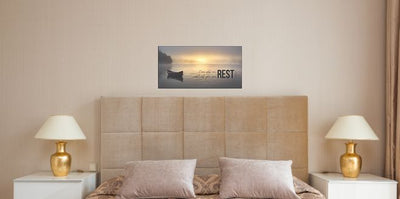 Rest Inspirational Plaque on wall above a bed.