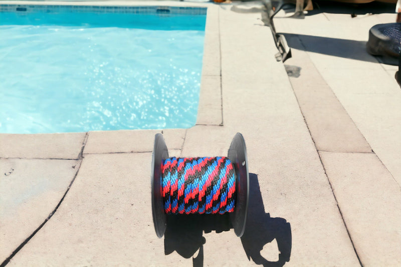 Blue, Red, and Black Solid Braided Multifilament Polypropylene Rope Near the pool
