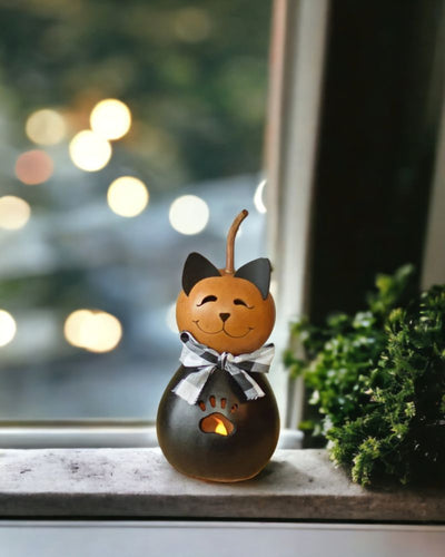 Cole doesn't have to be just for Halloween. If you love cats, keep this cutie out all year with the rest of your collection. 