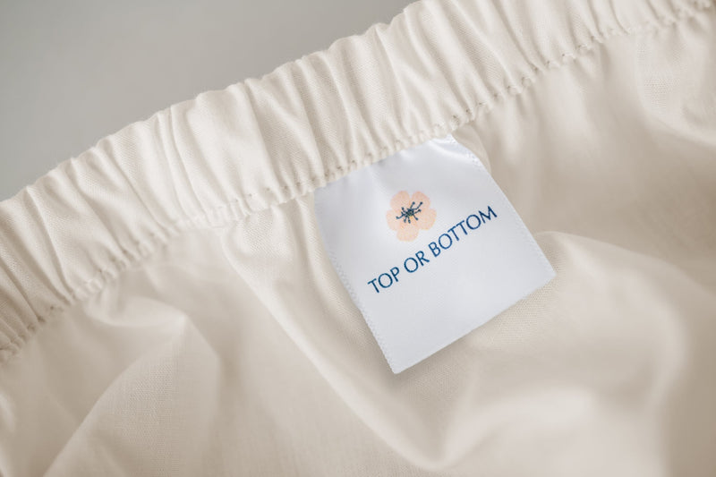 A helpful "Top or Bottom" tag is added so you know which end of the fitted sheet is up!!