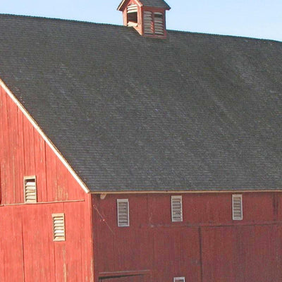 Comparison of a real barn to the Amish Made Red Barn Birdhouse 