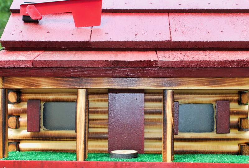 Close up of the red Amish Handmade Log Cabin Wooden Mailbox