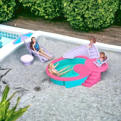  Featuring a large pool, winding slide, and a patio, dolls can swim or relax.