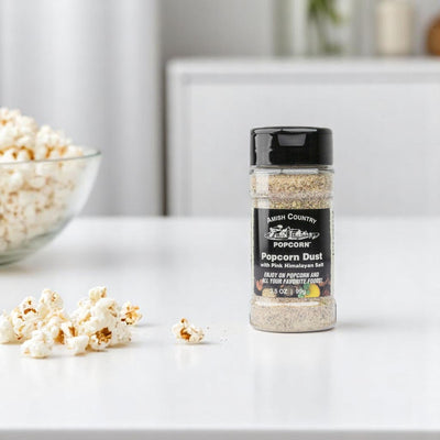 Amish Country Popcorn Dust With Pink Himalayan Salt by a Bowl of Popcorn