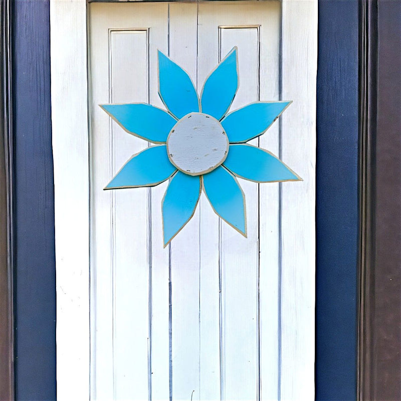 Blue and White Amish Made Wooden Flower Door Hanger makes a nice spring decoration. Available online at Harvest Array