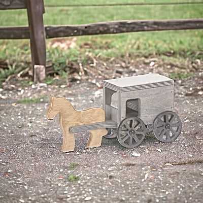 Black and Gray Horse and Buggy Wooden Playset outside.