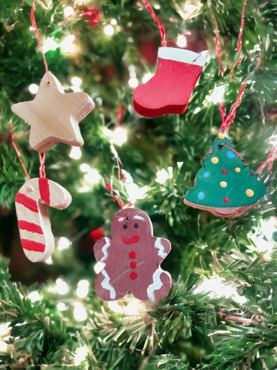 Cute set of 5 mini ornaments. Star, stocking, candy cane, tree, and gingerbread man are all hand cut and painted.