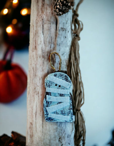 Small Handmade Wooden Mummy Ornament for Halloween Decorating on Harvest Array.