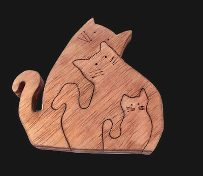 Handcrafted wooden cat puzzle featuring three snuggling kitties. Perfect for puzzle-loving children and cat enthusiasts.