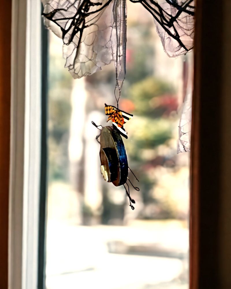 Side view of Small Handmade Wooden Googly Eyed Hanging Spider