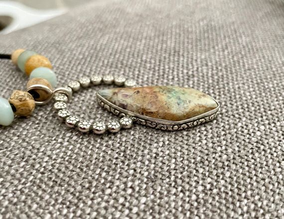 Side view of the Handmade Confetti Chrysocolla and Sterling Silver Pendant 