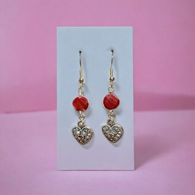 Handmade Heart Charm Dangle Earrings with Large Red Accent Beads on sterling silver ear wires.