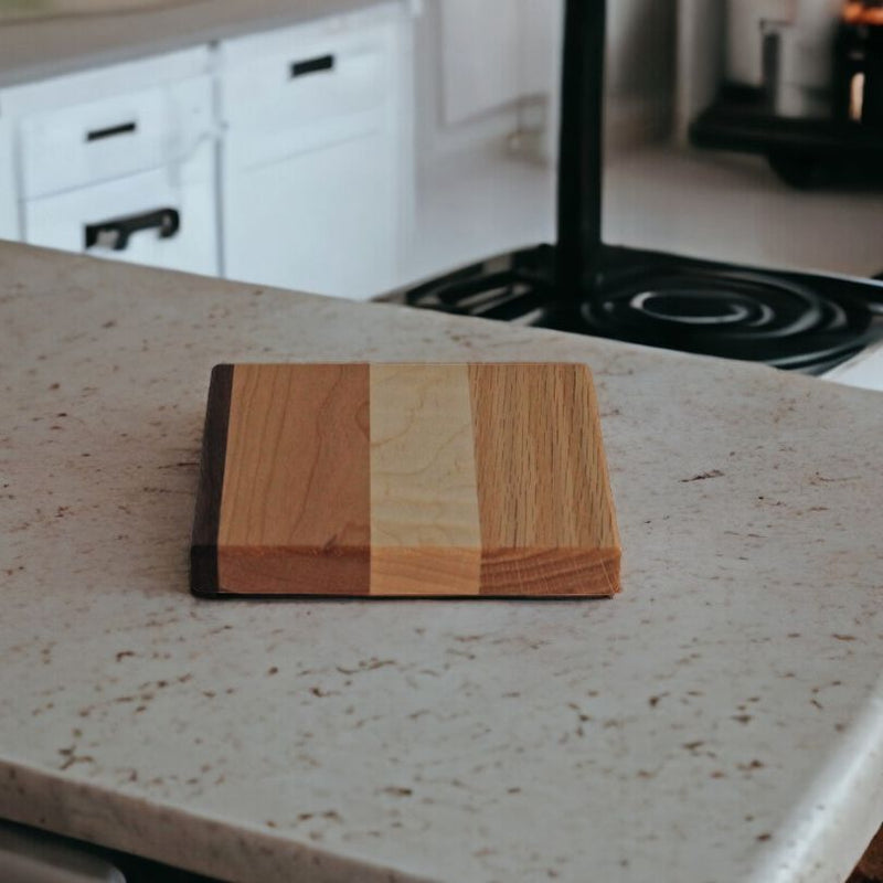 The Wood Hot Pad is a perfect size to sit a hot pot on when serving plates on a coutertop.