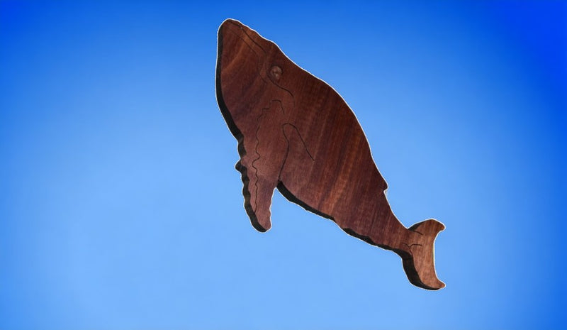 Wooden Humpback Whale Figurine - 7 x 3.75 Inches on blue background