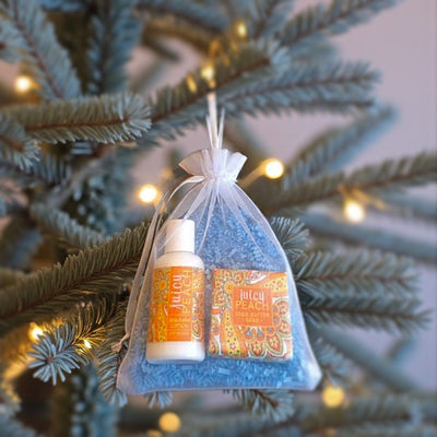 Teens and adults alike will love to find Harvest Array's Mini Soap, Lotion, and Soap Saver Gift Bag in Juicy Peach Scent hung on the Christmas Tree.
