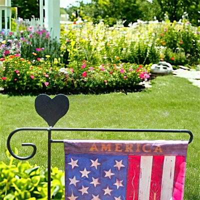 Dress up your yard and Metal Garden Flag Holder with Decorative Emblems on top., like this one with a heart. Available from Harvest Array.