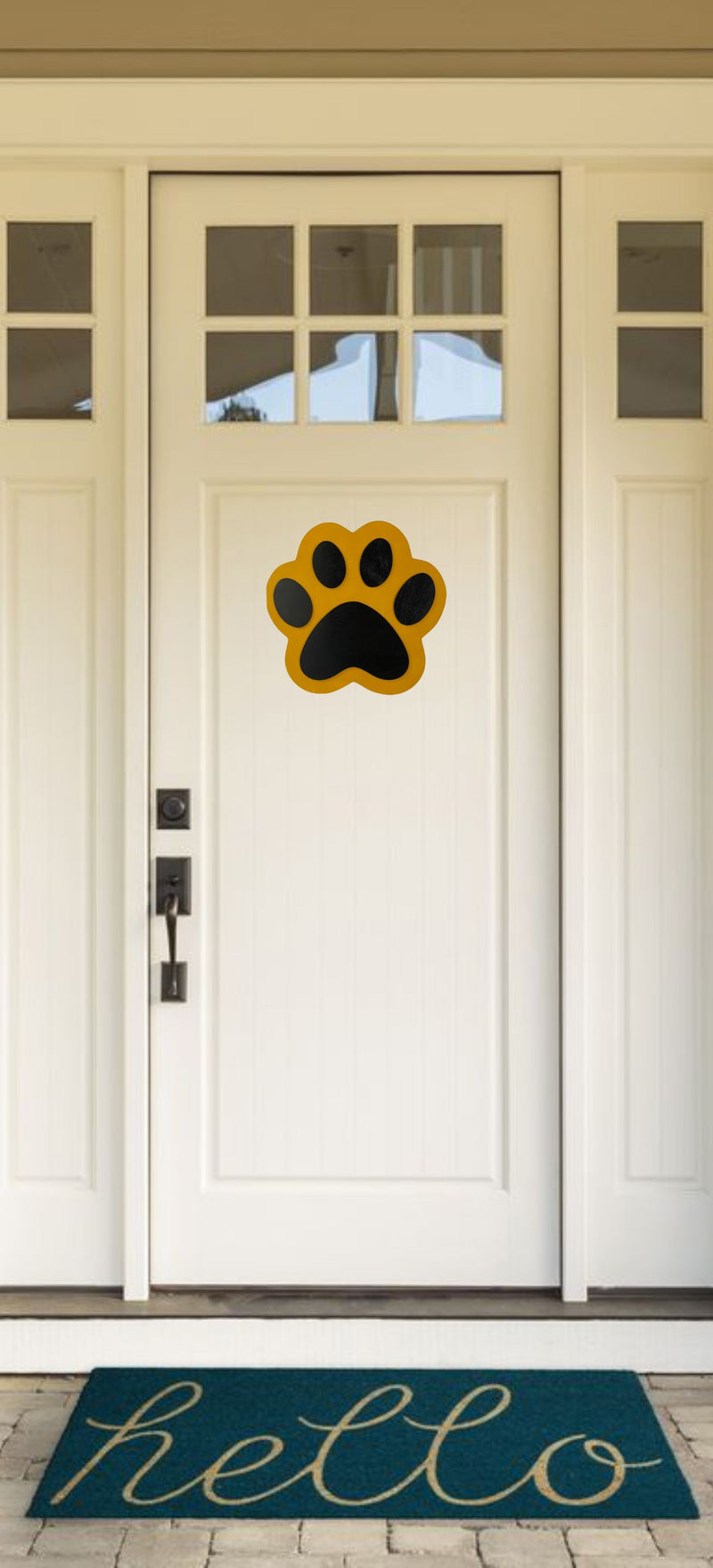 Yellow and Black Wooden Paw Print Door Hanger on a White Front Door.