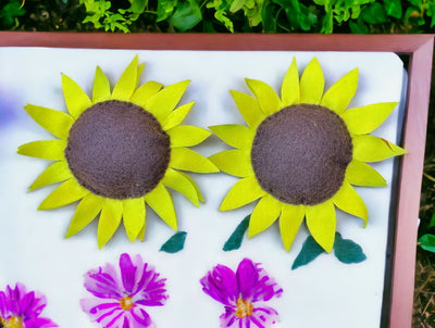 Handmade Sunflower Magnets on a magnet board.