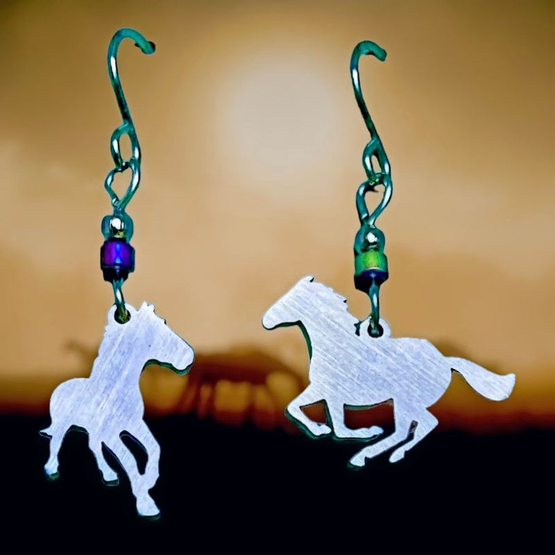 Horses Stainless Steel Earrings. The Laser Cut Horse on each earring are not identical making for a beautiful, compatible pair of earrings.
