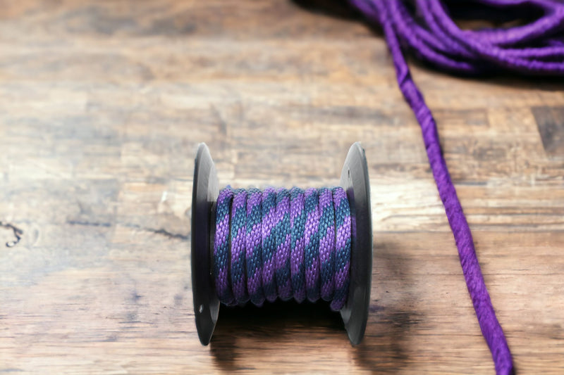Purple and Navy Solid Braided Multifilament Polypropylene Rope on the floor