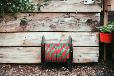 Green and Red Solid Braided Multifilament Polypropylene Rope by the Barn