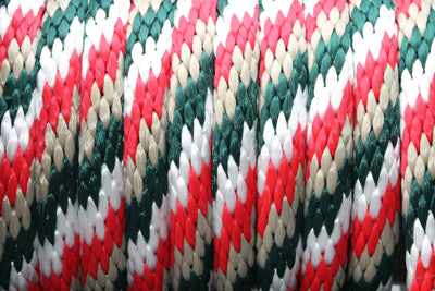 Close up the Red, Tan, White and Hunter Green Solid Braided Multifilament Polypropylene Rope