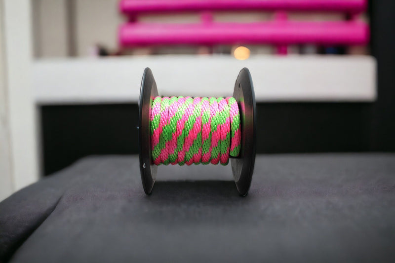 Hot Pink and Lime Solid Braided Multifilament Polypropylene Rope on a working table