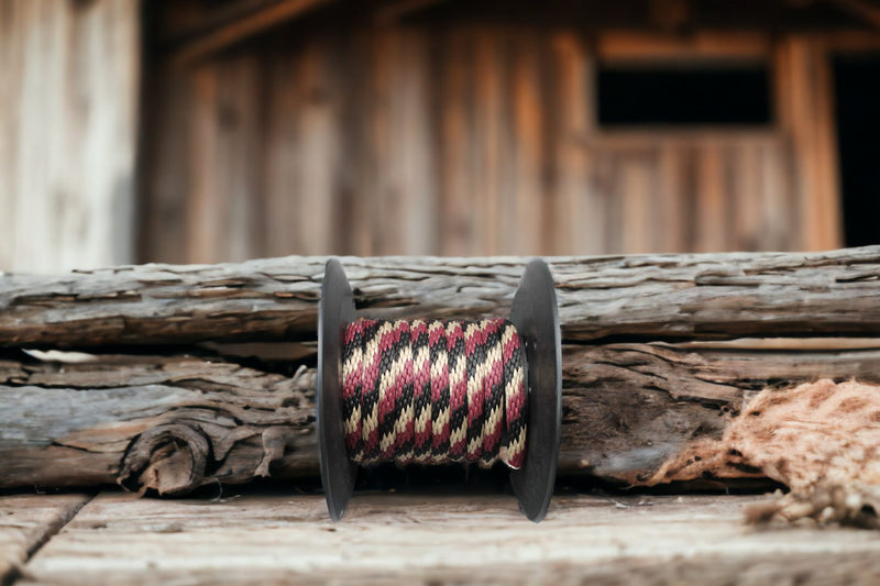 Burgundy, Black, & Tan Solid Braided Multifilament Polypropylene Rope near the barm