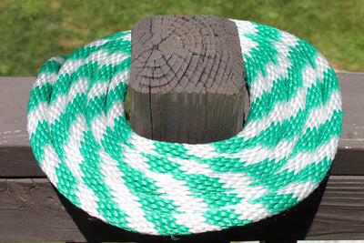 Green and White Solid Braided Multifilament Polypropylene Rope on a post