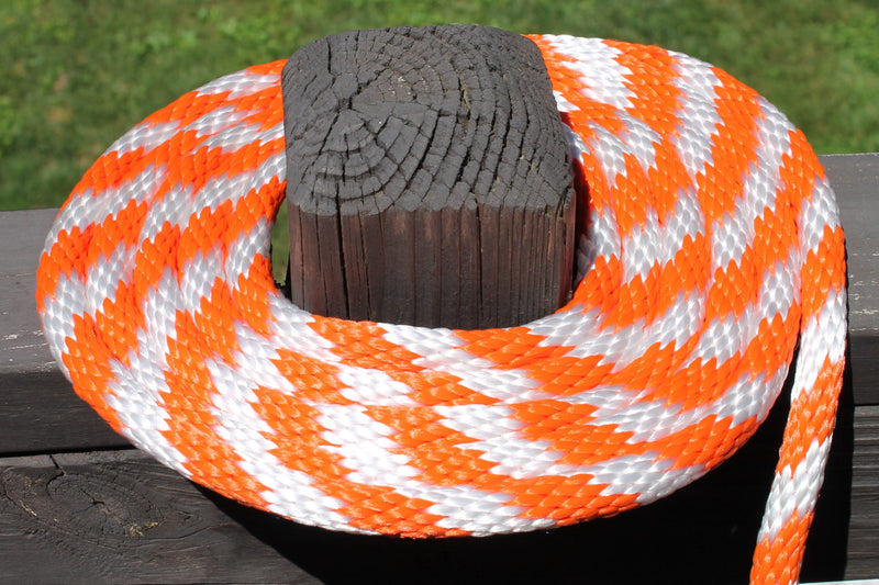 Orange and White Solid Braided Multifilament Polypropylene Rope on a post
