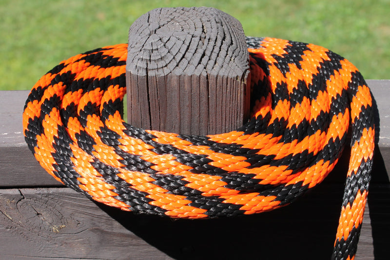 Orange and Black Solid Braided Multifilament Polypropylene Rope on a sunny post