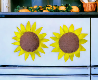 Handmade Sunflower Magnets on a refrigerator.