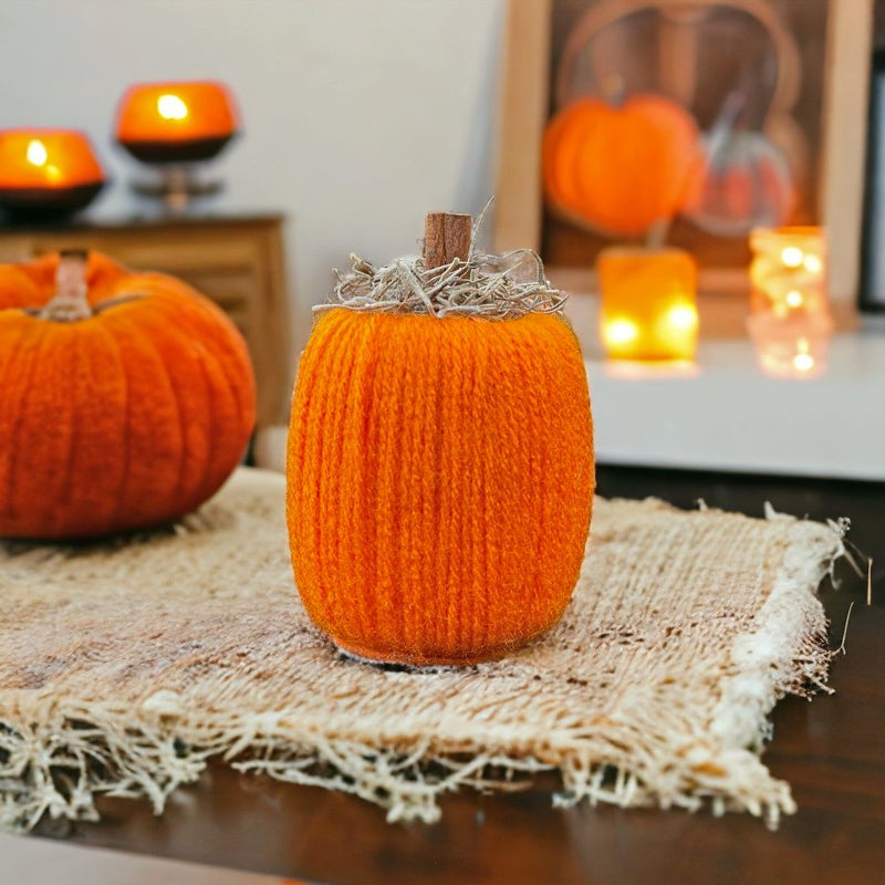 Rustic Orange pumpkin with Spanish Moss and a wooden handle.