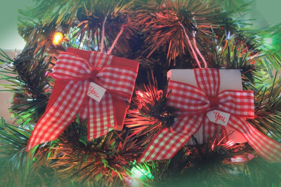 Choose a red or a white Gift with Bow Christmas Ornament. Made in America.