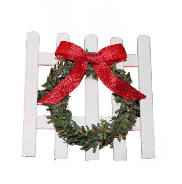 Handcrafted Mini Picket Fence with Bow Christmas Ornament close up.
