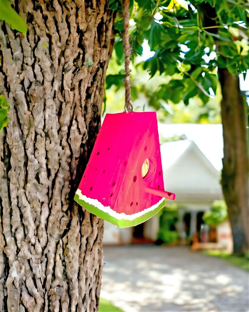Handmade Wooden Pink Watermelon Shaped Birdhouse with perch side view. Adorable birdhouse for purchase at Harvest Array.