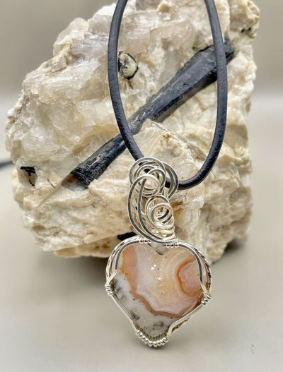 The sterling silver wire wrap is so artistic and adds brilliance to this pendant.