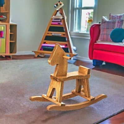 Amish Made Wooden Rocking Horse in a playroom.