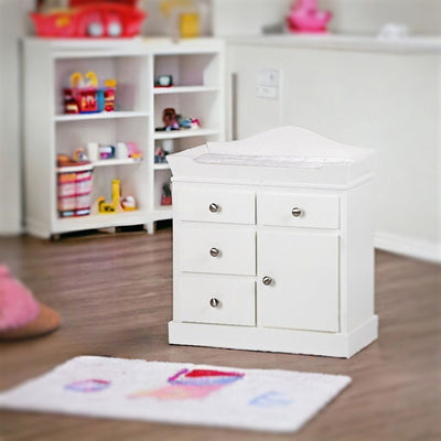 White Wooden Changing Table for Dolls shown in a playroom.