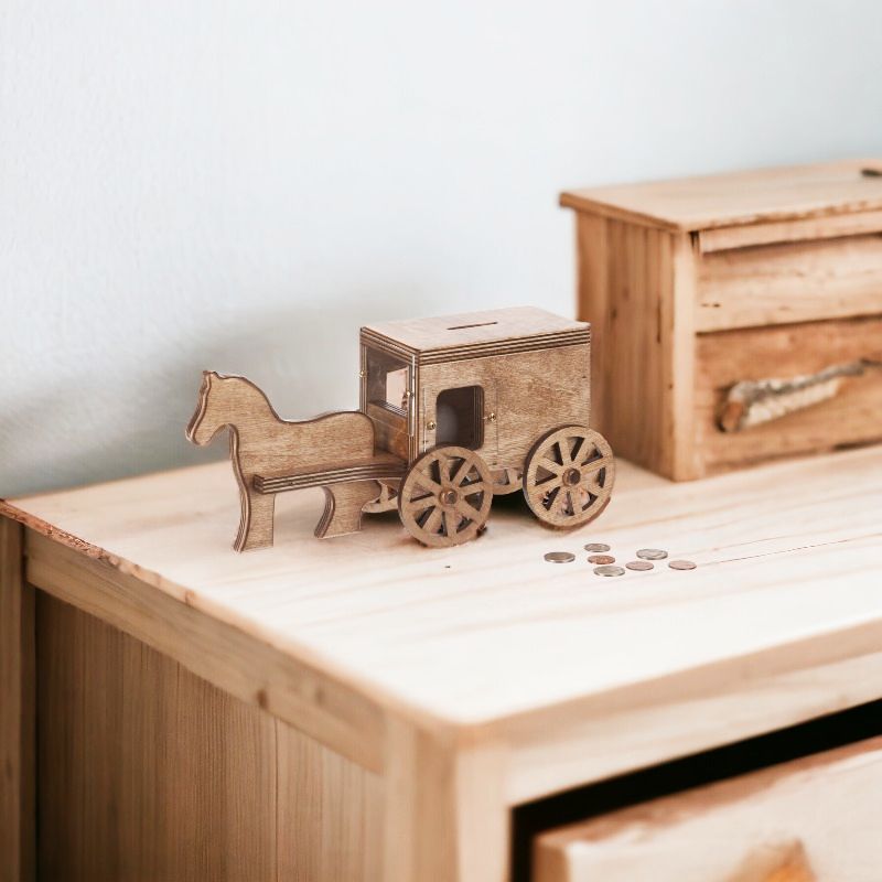 Amish Made Horse and Buggy Wooden Coin Bank sitting on a dresser.