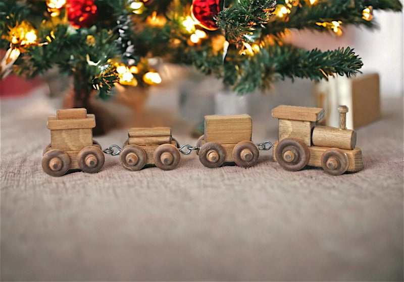 Amish Made Small Wooden Toy Trains make great toys and decorations. This train is natural wood with harvest-stained wheels.