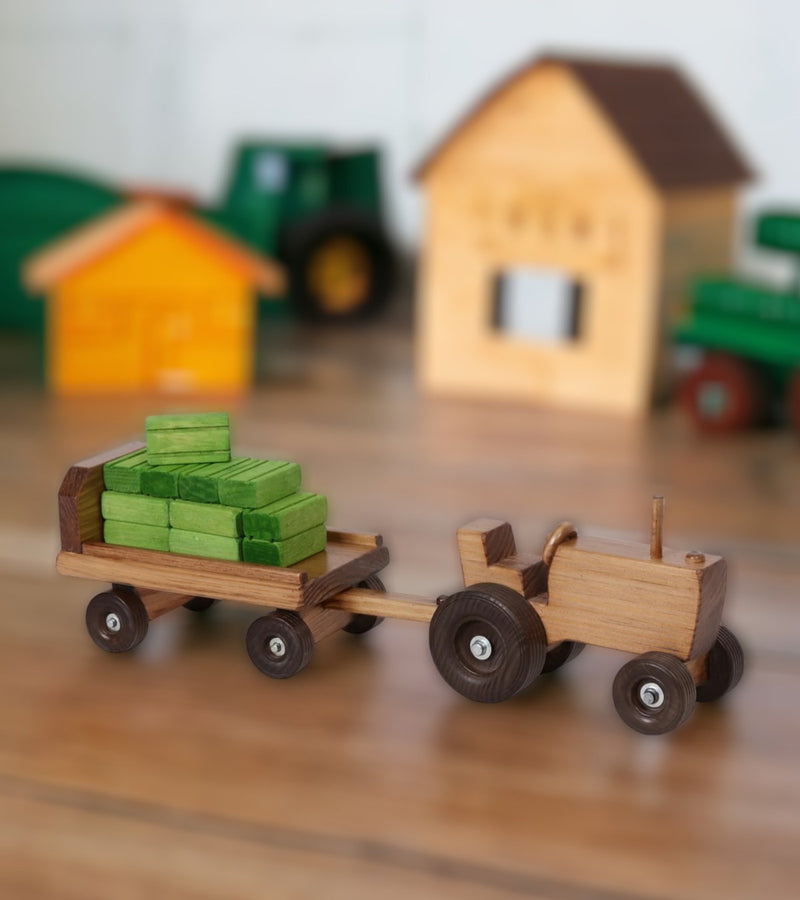 Handmade, durable wooden tractor toy with toy hay bales. Crafted from sustainable wood and made in USA. Free shipping.