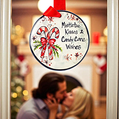 Hand Painted Mistle Toe Kisses and Candy Cane Wishes Christmas Ornament from the Nola Watkins Holiday 2025 Collection now at Harvest Array.