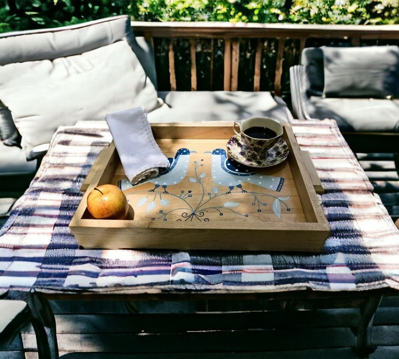 Two Bird Folk Art Tray with coffee, an apple, and a napkin on it. Used for taking breakfast to outdoor table.