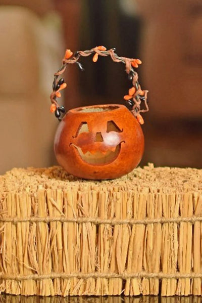 Party Treat Jack Basket Gourd has a cute jack-o-lantern face perfect for non-scary Halloween decorating.