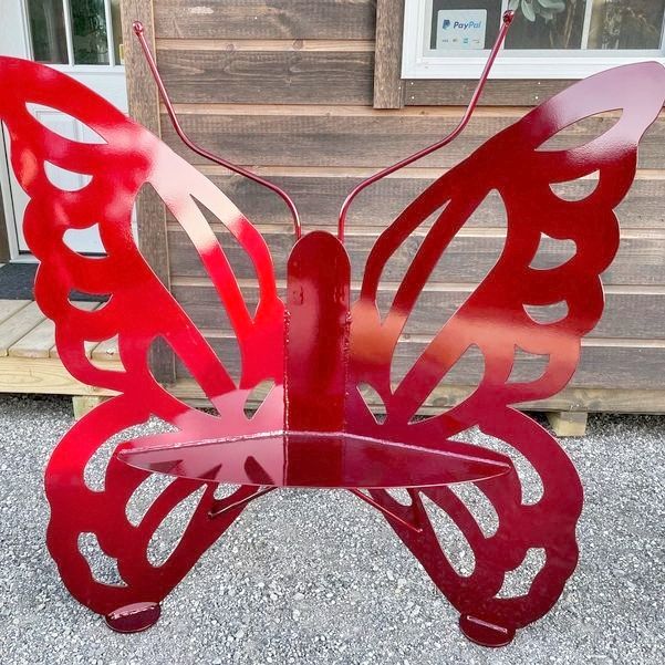 Small Red Metal Butterfly Bench - Design A with scalloped wings and long antennae.