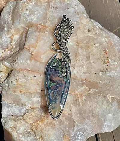 Teardrop shaped Natural Moss Agate Sterling Silver Wrapped Pendant comes on a 26 inch leather cord necklace available on Harvest Array.