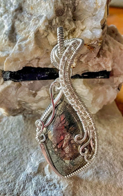 The Earthy tones of the Nipomo Marcasite Agate show through in this photo of the pendant.